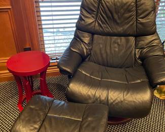 Leather reclining armchair and ottoman - from "Relax the Back" shown with red side cocktail table
