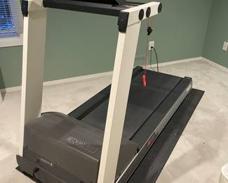 Precor Elliptical machine and mat