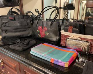 Tumi travel case, purses, and evening bags