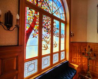 Many of the stained glass windows, including this masterpiece in the grand staircase were restored with TIFFANY glass!