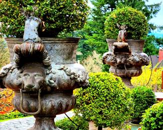 Pair Iron Lion Head and Peeking Putti Planters $1,150 or bid #147