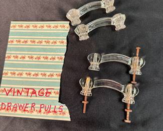 Set of 4 vintage glass drawer pulls, 2 have cracks but are intact, 2 are in good condition, 3" between screws