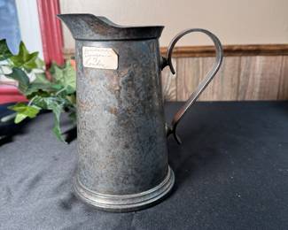 Glass bottomed metal (pewter?) small jug with ice lip labeled as purchased from Duncan's of London 7"H