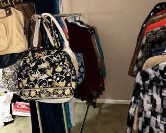 Loads of clothes and handbags 