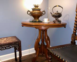 Antique lamp on Victorian oval side table