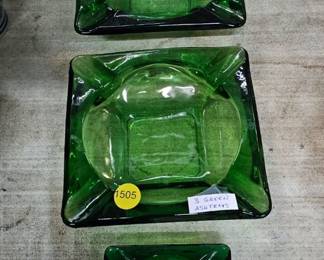 THREE GREEN GLASS ASHTRAYS
