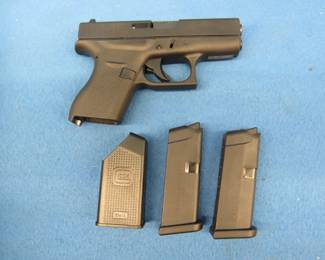 Lot 403. Glock Model 42.&nbsp; 380 cal.&nbsp; Never fired.&nbsp; Includes original hard case, manual, two magazines, and a speed loader.&nbsp; Serial no. U14250201