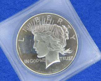 Lot 105. Peace Dollar .999 Silver Round