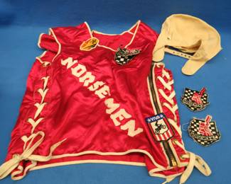 Lot 237. 1960s-era motorcycle racing vest and patches