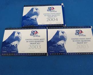 Lot 95. Two 2003 and one 2004 US Mint quarter sets