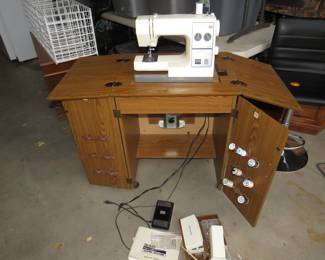 Lot 455. Sears Kenmore sewing machine with cabinet and accessories