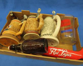 Lot 244. Beer steins, tap handles, and more