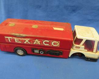 Lot 243. Metal Texaco fuel truck that is missing the front axel