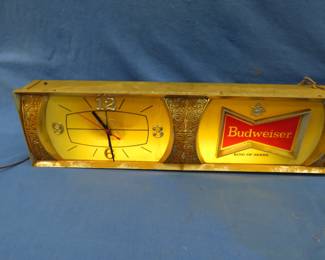 Lot 360. Budweiser hanging light and clock. The light works but the clock does not