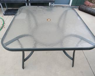 Lot 450. 45x45x27 glass-topped patio table