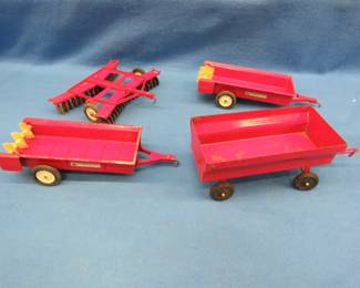 Lot 48. Four metal farm toys