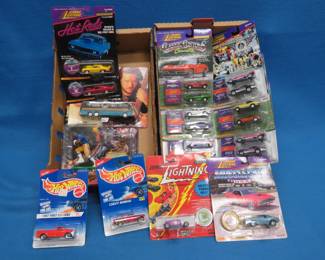 Lot 149. New In Box; Johnny Lightning Classic Customs, JL Hot Rods, Hot Wheels, Tony Dorsett Heisman Figure and Travis Tritt's Tour Bus