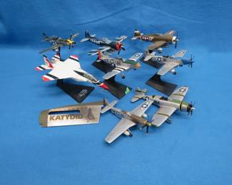 Lot 42. Eight Die-Cast Model Planes and Bomber Art Panel