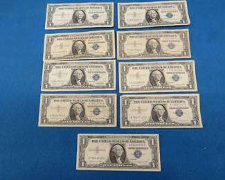 Lot 313. Nine $1.00 silver certificates.&nbsp; Series 1957 A.