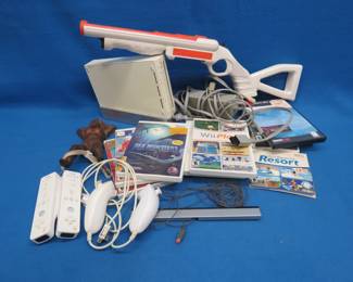 Lot 146. Nintendo Wii, Games, and Boot Remover