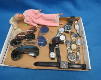 Lot 376. Sunglasses, Watches, and a Barbie