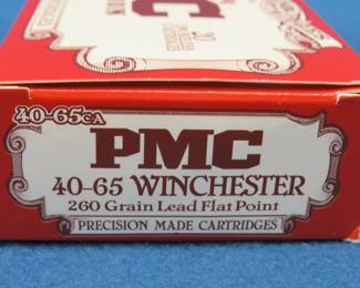 Lot 57. 13 PMC 40-65 Winchester rounds, plus 7 empty cartridges