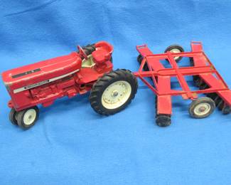 Lot 77. Ertl Tractor and Disc