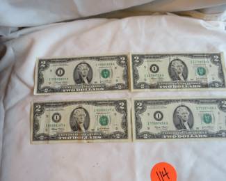 Lot 134. Four Series 2003 $2.00 bills in excellent condition