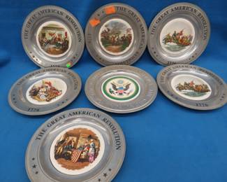 Lot 345. Seven 1975 aluminum plates with porcelain plate inserts