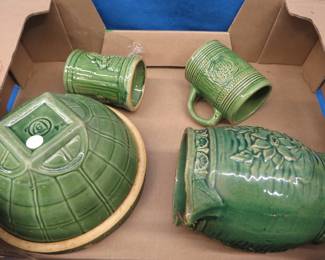 Lot 106. Green pottery and ceramic planters. (See photos for more items)