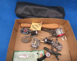 Lot 250. Vintage fishing gear, belt buckles, and more