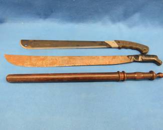 Lot 261. Vintage policeman's billy club and two machetes