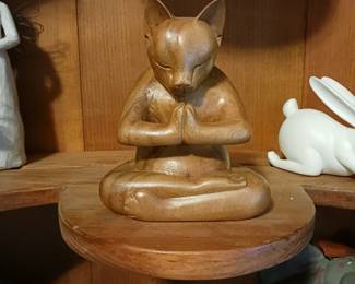 Wood curved cat and a yoga pose