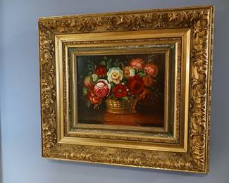 Floral still life painting in a gold frame