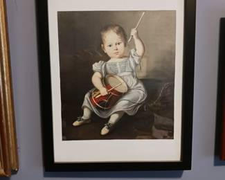 Child playing a drum framed art picture