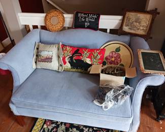 Custom pillows and blue loveseat poster