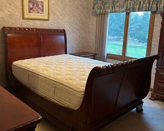 Cherry sleigh bed/queen with new mattress and box spring