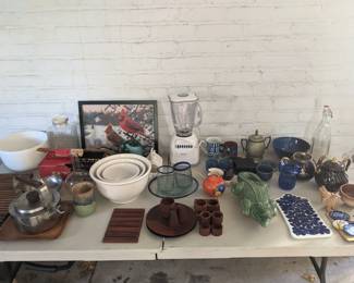 KETTLE, TRIVETS, TEAK LOT, ALLIGATOR, BLENDER,  BOTTLE, BLUE BOWL, GLASSWARE, ORANGE CREAMER, METAL POT W/EARS ALL AVAILABLE