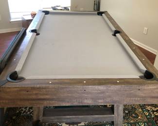 Pool table and 4 pool cues 