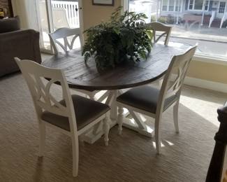 Reclaimed wood dining table by Liberty Furniture seats 4