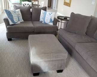 Gray couch, loveseat and ottoman/coffee table by Lloyds of Chatham, NC. Couch is a sleeper sofa!
