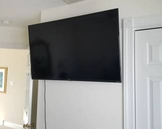 Flat screen smart TV with wall mount and feet