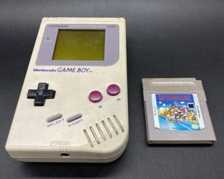 Vintage nintendo game boy and mario game
