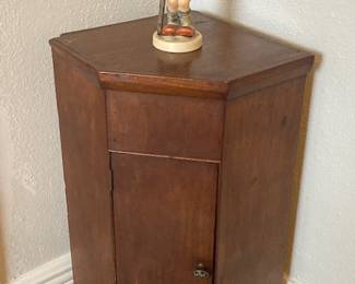 antique corner cabinet and early (1950's Hummel)