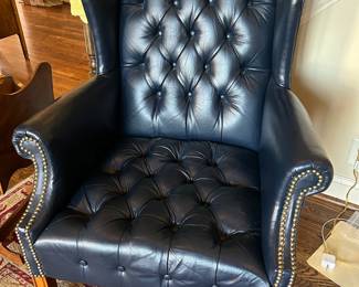 tufted blue leather wing chair