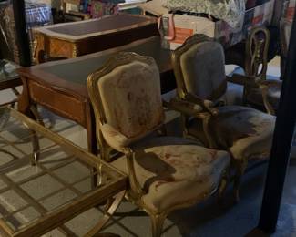 Misc. furniture, metal end tables and coffee tables with glass inserts, writing desks, sewing machine with cabinet, tapestry chairs with and without arms, misc art decor and canvas prints 