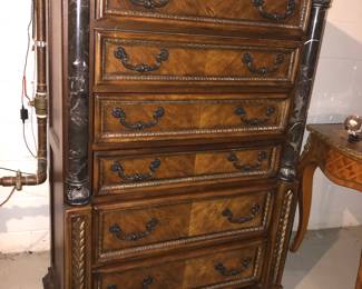 6 Drawer tall dresser.  Matching king size bed also for sale.  Will sell together or separate.  Wood and black marble.