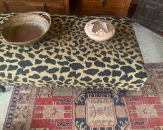 Needlepoint ottoman, antique rug