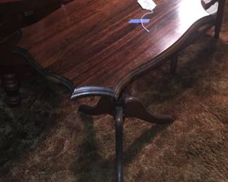 A Duncan Phyfe-style end table sports a curvy top with nice edges. 