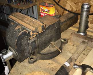 A heavy-duty vise along with a few hand tools n